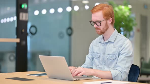 Loss, Casual Redhead Man Reacting To Failure on Laptop in Office 