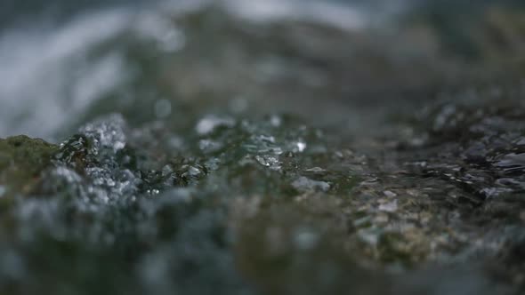 Transparent Water with Bright Sunlight Reflections Falls