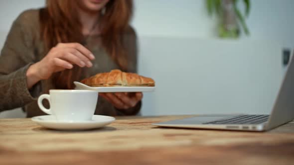 Woman Driking Coffee and Working in Coffeeshop