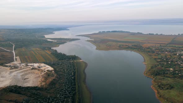 Aerial drone view of the Duruitoarea natural reservation in Moldova. River and fog in the air, hills