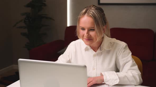 Smiling Young Woman Has Video Calling Chatting for Remote Job Interview Using Laptop Webcam