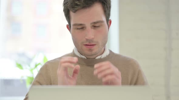 Close Up of Man Having Headache While Using Laptop