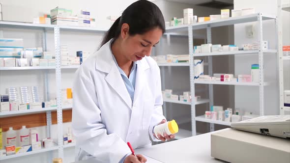 Pharmacist holding a drug box