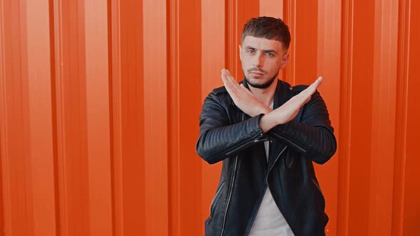 Man Shows Stop or Rejecting Gesture, Dislike or Disagree Sign, Crossing Hands