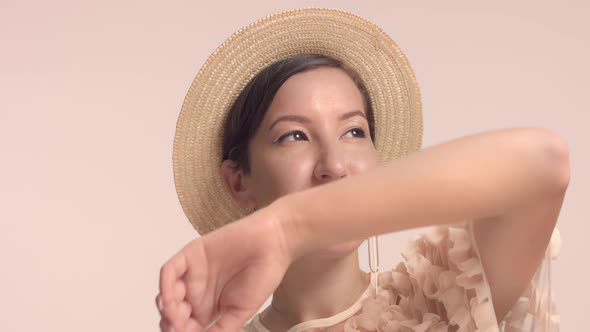 a Young Moroccan Woman Wears a Hat in the Studio and Monochrome Makeup