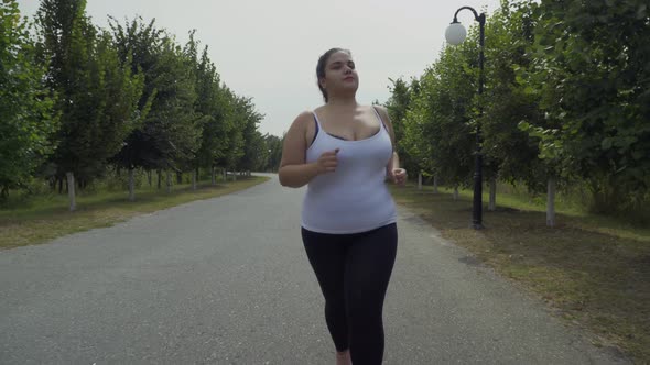 Fat Girl Runs Along the Road