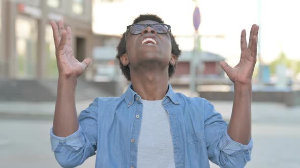 Angry Young African Man Shouting and Screaming Outdoor