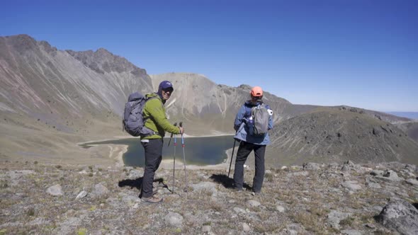 Couple Trekking on the natural landscape. Hiking man and woman