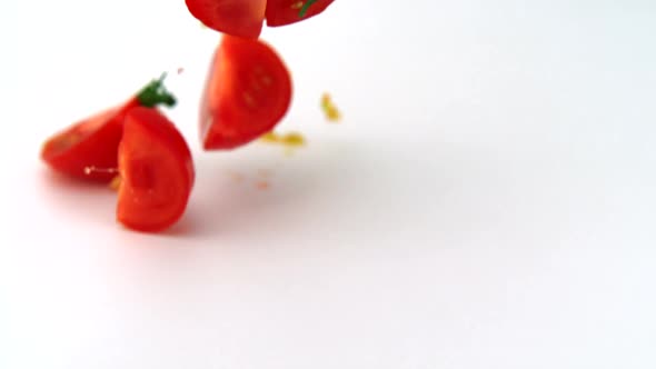 Slo-motion tomato wedges falling