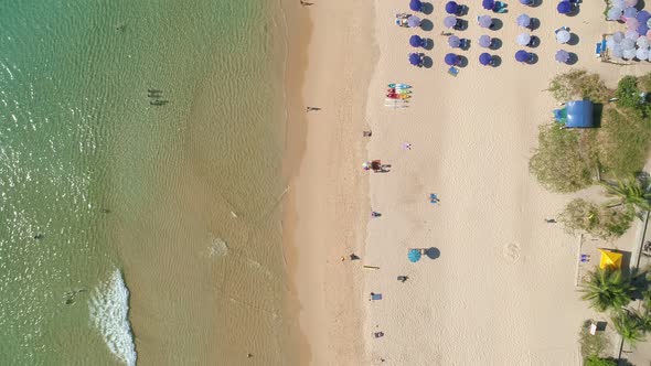 Aerial view drone camera of Beautiful tropical sea sandy beach and waves crashing against sand beach