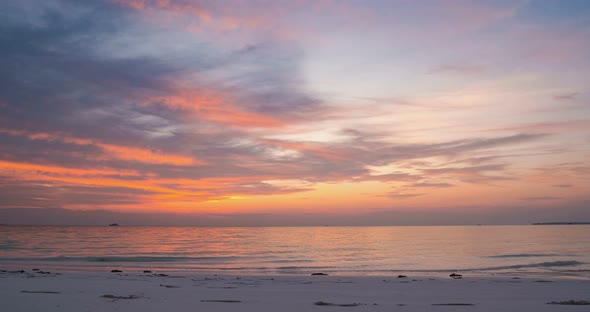 Time lapse: sunset over tropical beach caribbean sea colorful dramatic sky moving clouds