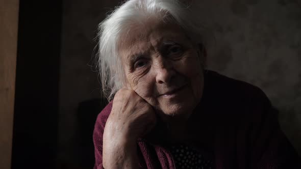 Portrait Of Very Old Elderly Caucasian Woman With Gray Hair And Wrinkled Face