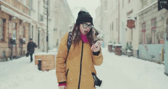 Girl Having Good News on Smartphone