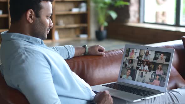 Young Indian Man Using Computer App for Video Communication