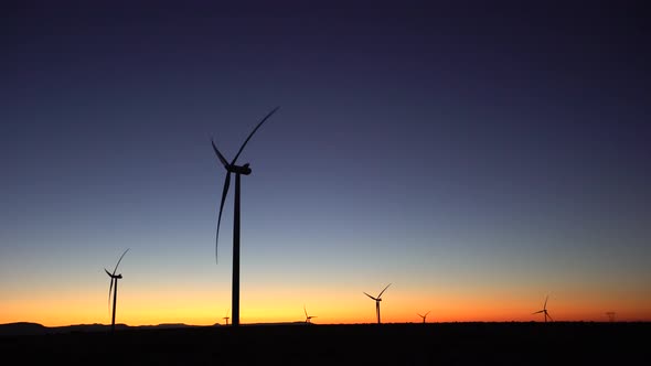 Wind turbines at sunset.