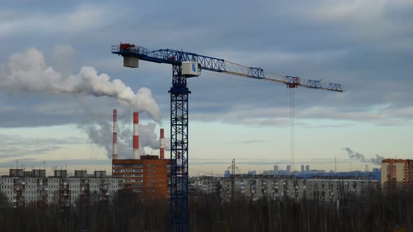 Timelapse Footage of Crane at Smoking Pipes Background