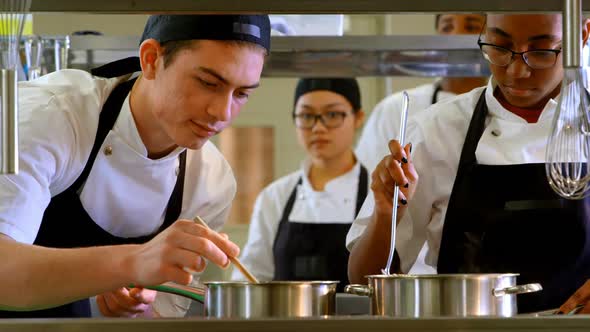 Chef preparing food in kitchen at restaurant 4k