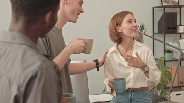 Colleagues Chatting on Break in Office