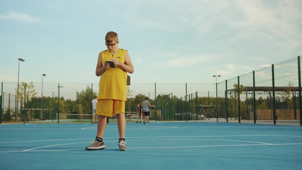 Young boy calculating on a court