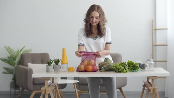 Young Cute Woman Preparing To Cooking a Salad