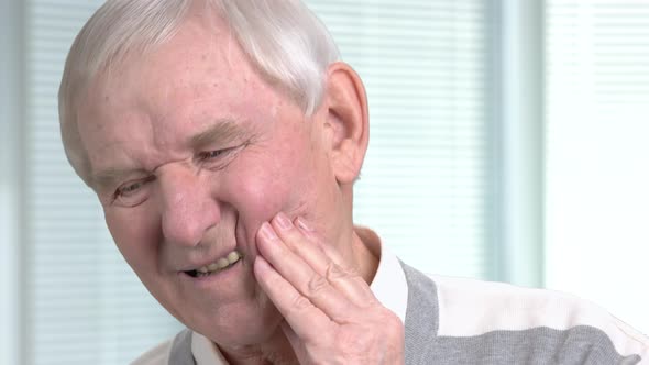 Unhappy Senior Man Having Toothache.