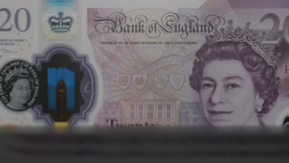 20 English Pound banknotes in cash machine.