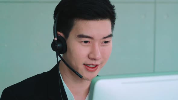 Business People Wearing Headset Working in Office