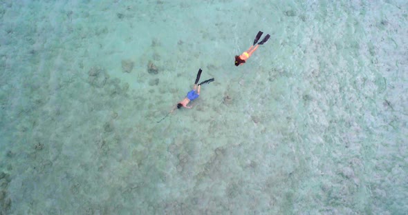 Couple snorkeling in the sea