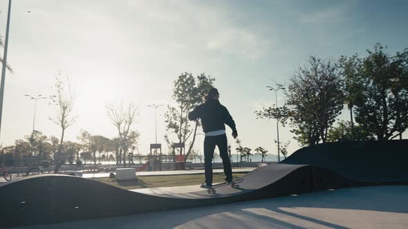 Skateboarder on a Pump Track Park