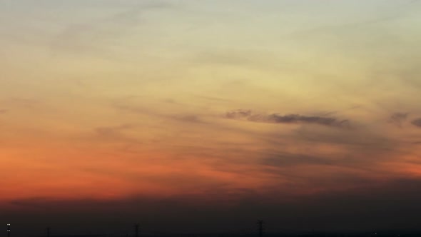 Time lapse sunset sunrise and beautiful twilight fluffy storm cloudy blue and yellow sky