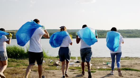 Big Diverse Group of Volunteers Beside the Beach