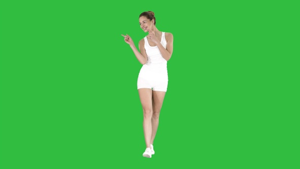 Attractive healthy young woman laughing on a Green Screen