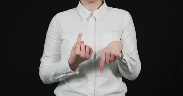 Woman's fingers pointing up and down