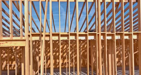 Wood Frame House Under Construction in Suburban New Stick Beams Built with Wall