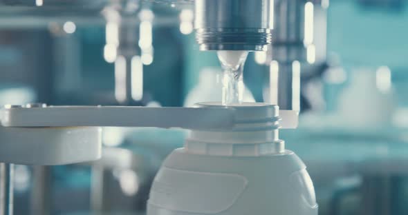 Filling of chemical bottles in a production line