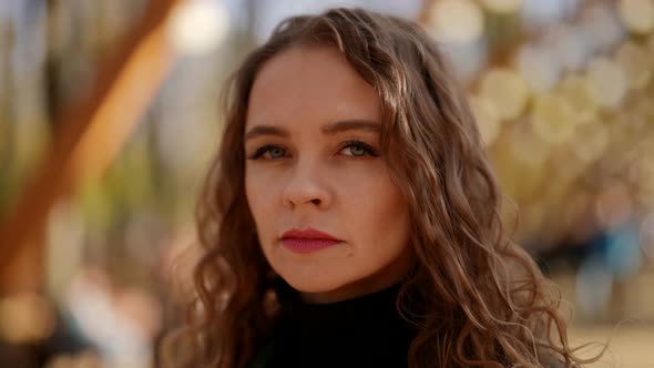 Portrait of Sad and Frustrated Woman on Street in Autumn Day Closeup of Face