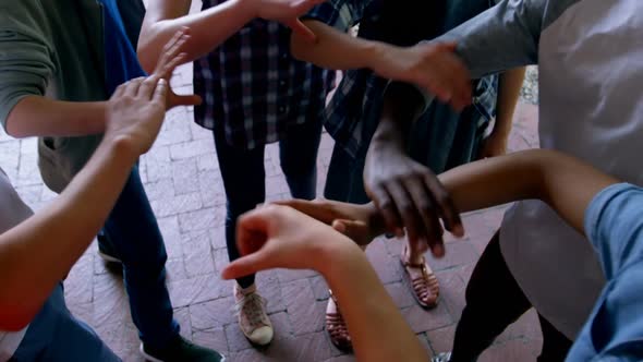 Schoolkids holding each other hands in school premises 4k