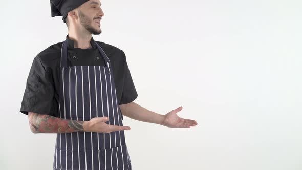 Happy Smiling Chef in Uniform Presenting Invisible Product