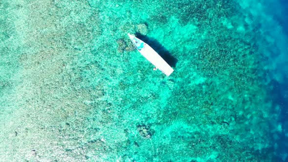 Aerial nature of tropical island beach vacation by turquoise ocean with white sand background of a d