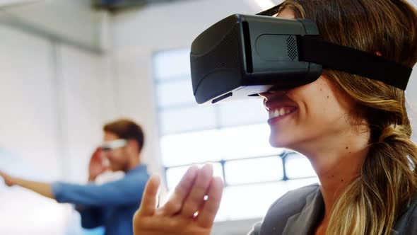 Female business executive using the virtual reality headset