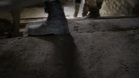 Closeup of Army Soldiers Feet Climbing Up Stairway