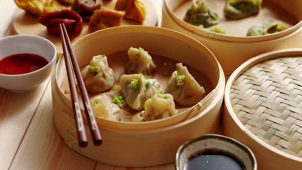 Traditional Chinese Dumplings Served in the Wooden Bamboo Steamer