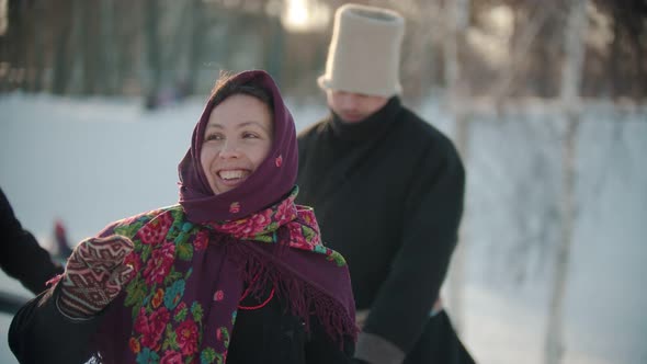 Russian Traditions - a Woman in Traditional Clothes Is Dancing Merrily To the Music of the Accordion