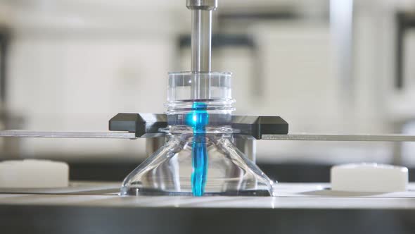 Automated pharmaceutical manufacturing line, bottles filled with liquid