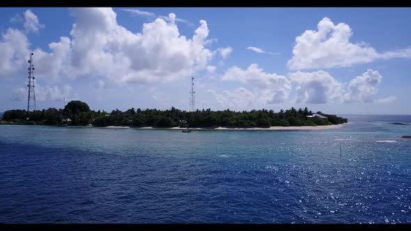 Aerial drone shot scenery of paradise bay beach voyage by blue ocean and white sandy background of a