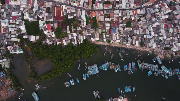 Phan Thiet harbor and overpopulated town in Vietnam, aerial top down view