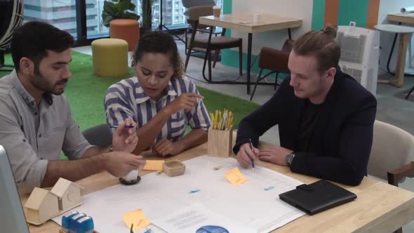 Creative Business People Group Having Conversation at Office Desk in Workplace