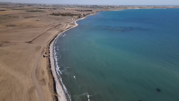 Cyprus beach at daytime. Mediterranean Sea. Beautiful views of the coast. Larnaca District.