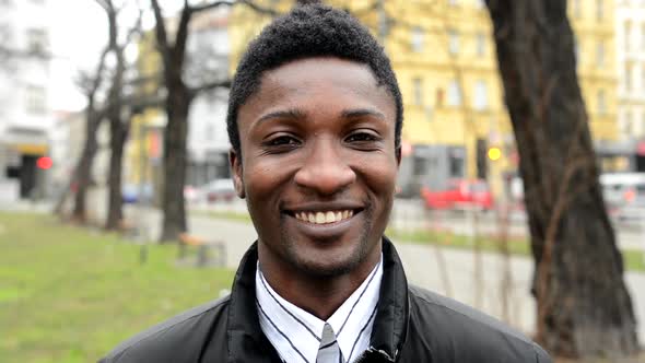 Handsome Black Man Laughs - Urban Street with Cars - City - Closeup