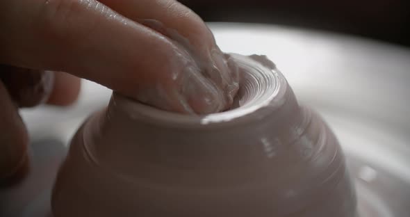 Close Up View Potter Sculpts a Jug From Red Clay on a Potter's Wheel Pottery Workshop Potter Makes